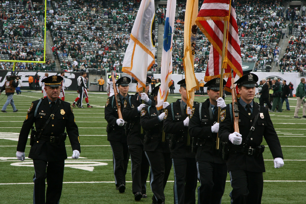 Honor Guard marches off the field. 